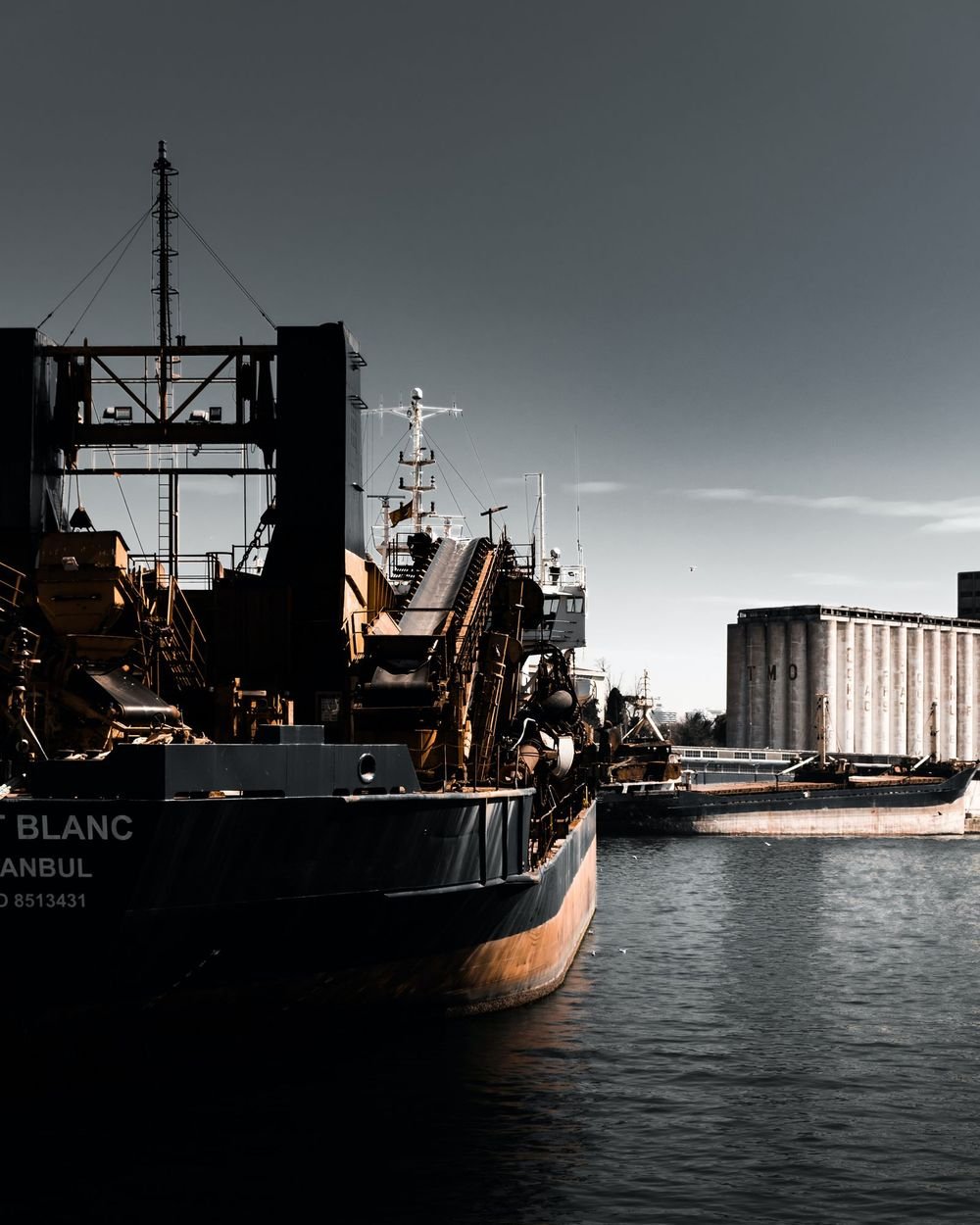 A bulk carrier loading at an industrial berth