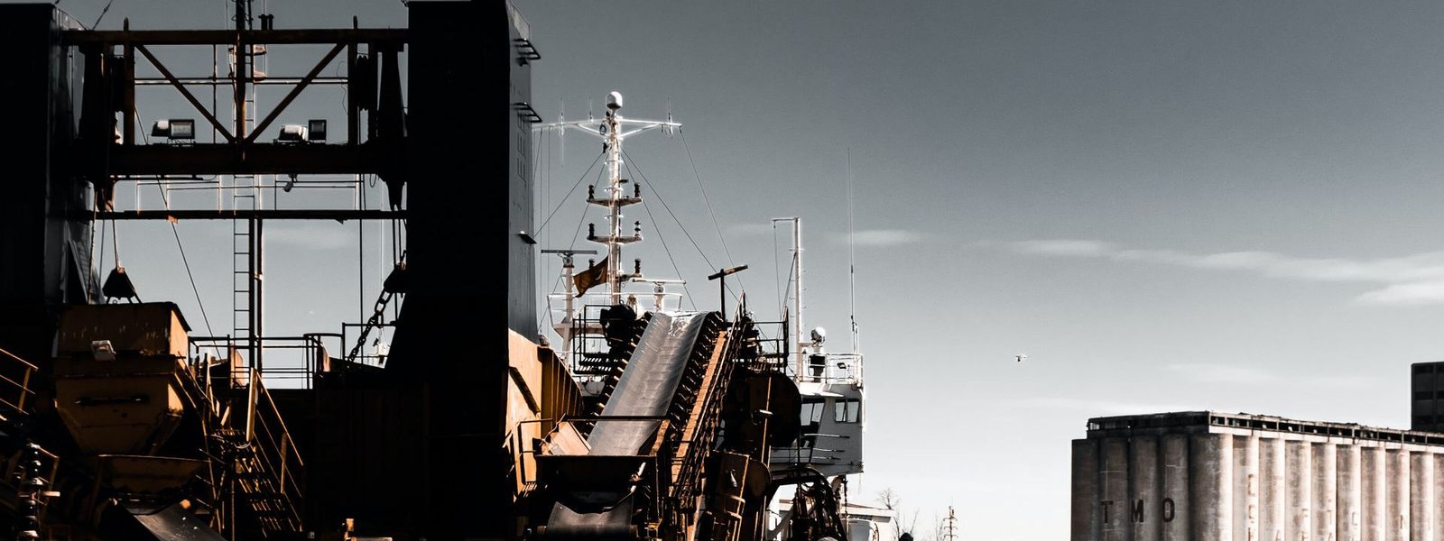 A bulk vessel alongside an industrial quay